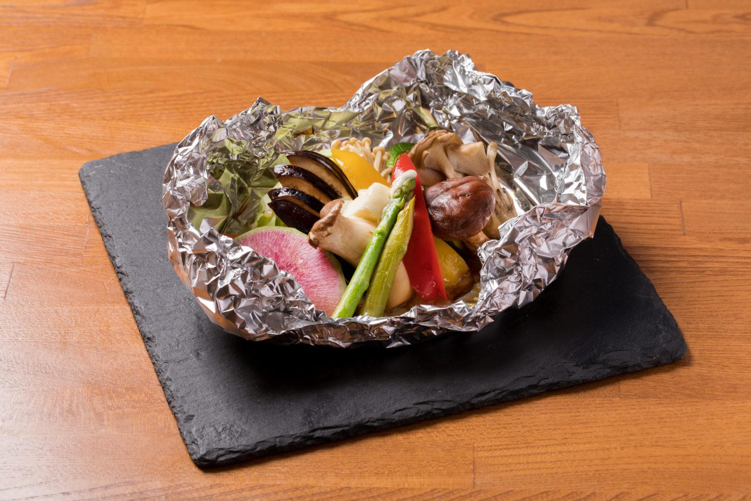 Vegetables baked in foil with butter and soy sauce