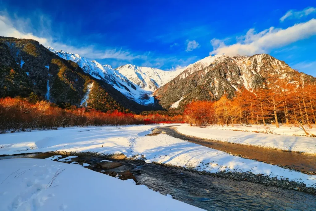 The Azusa river in Kamikochi showcasing early Spring scenery with snow.