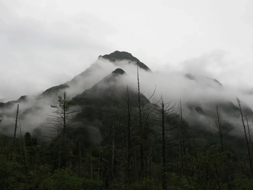 Fog and mist roll over Mount Dakesawa in Kamikochi.