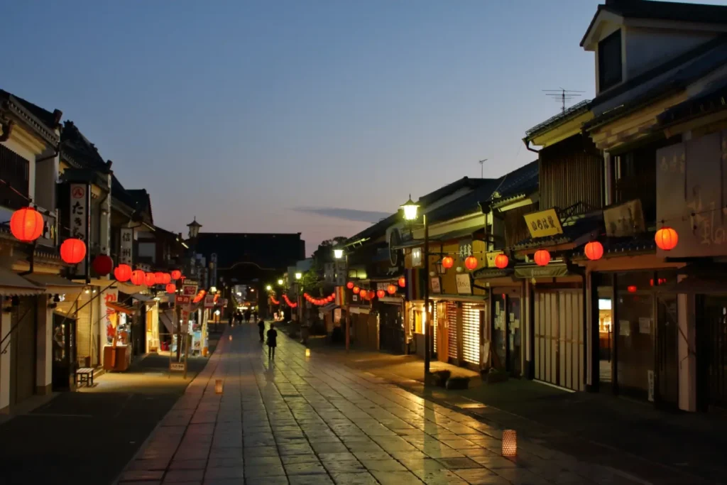 A serene scene of the shopping street at Zenkoji Temple at sunset.