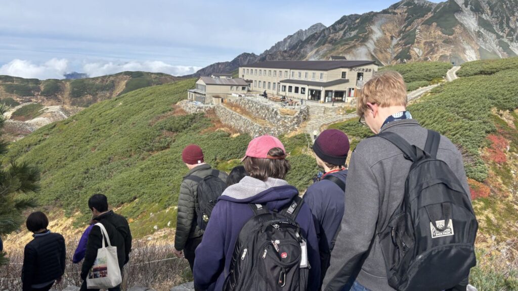 Day-trippers walk around the Murodo Plateau along the Alpine Route in Autumn.