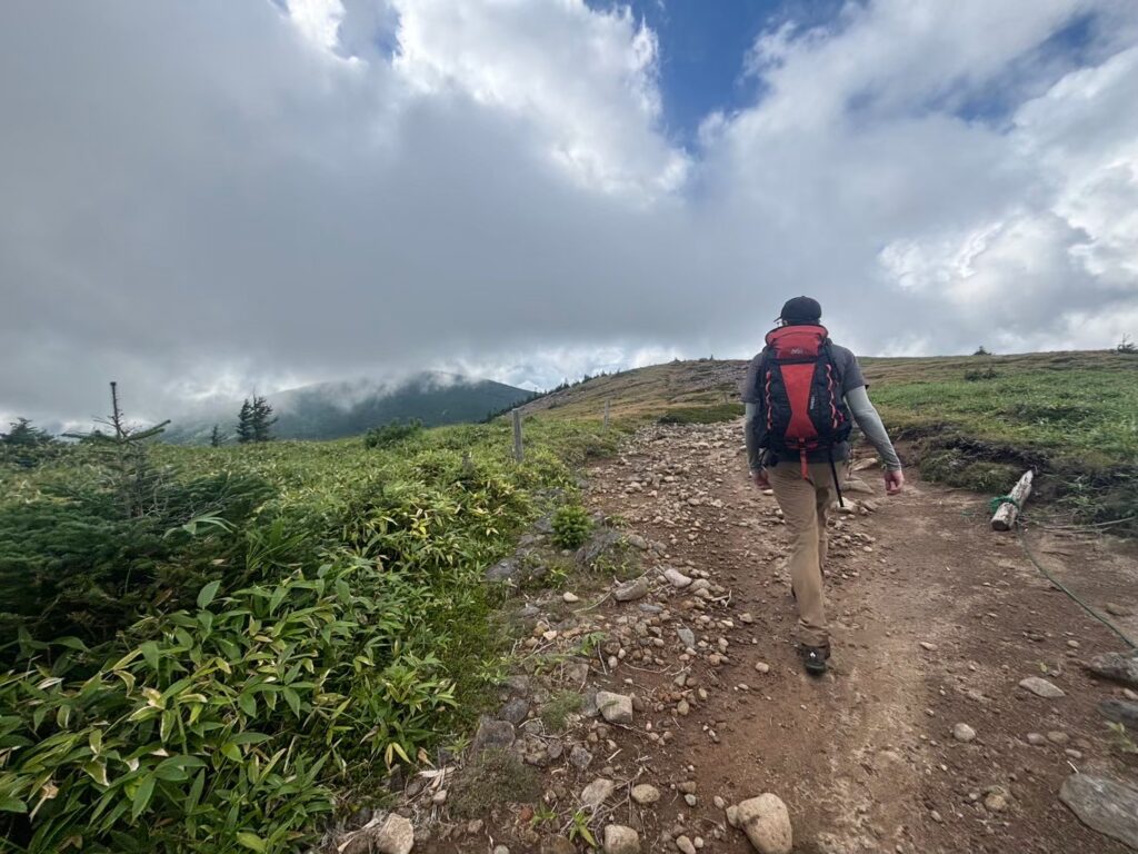A hiker walks close to the summit of Mt. Tateshina in Nagano, Japan.